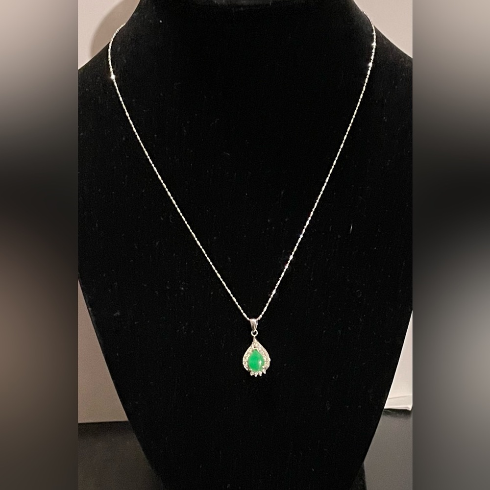 A pretty jade and diamond pendant on a 14k white gold necklace